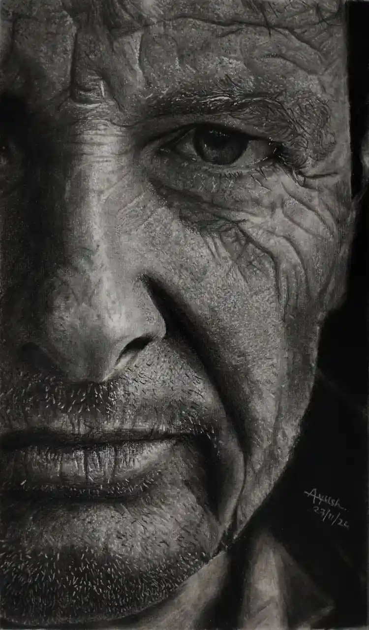 A highly detailed, realistic charcoal drawing of an elderly man's face, showing deep wrinkles, textured skin, and intense…