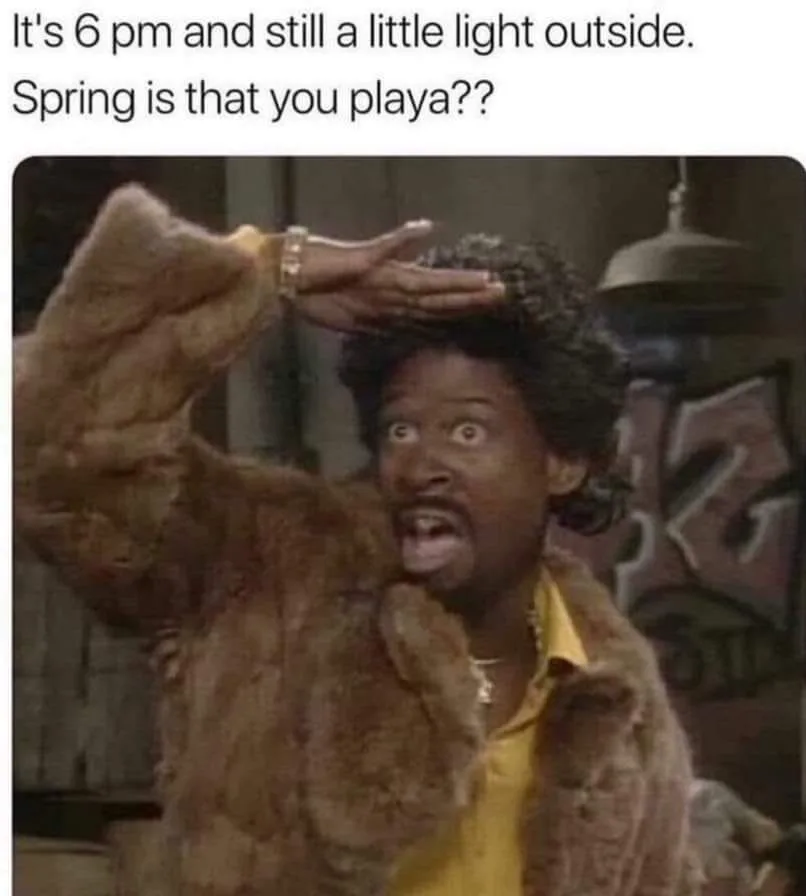 A man in a brown fur coat and yellow shirt looks shocked and confused, holding his hand to his forehead as if questioning…