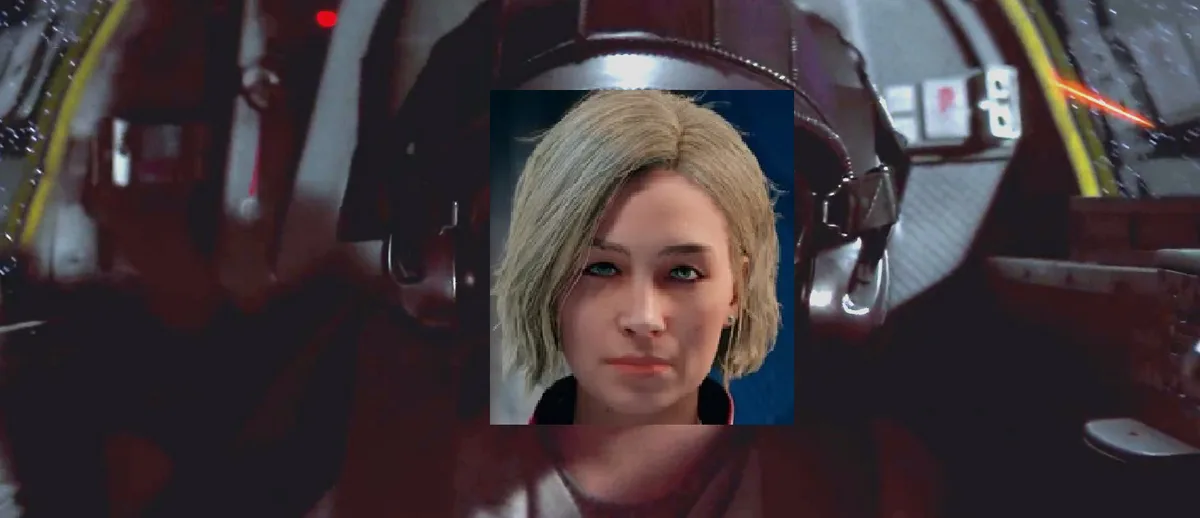 The image shows a close-up of a person with short blonde hair and blue eyes, looking directly at the camera with a neutral…