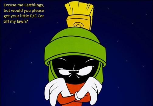 A cartoon Martian character with a green helmet and yellow antenna stands against a starry night sky, arms crossed and…