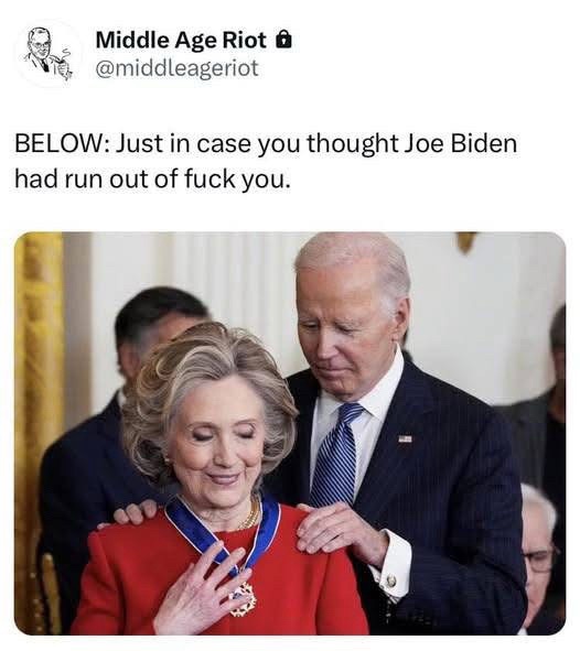 A photo shows Joe Biden placing a medal on Hillary Clinton's chest while she smiles. Biden has his hands on her shoulders…