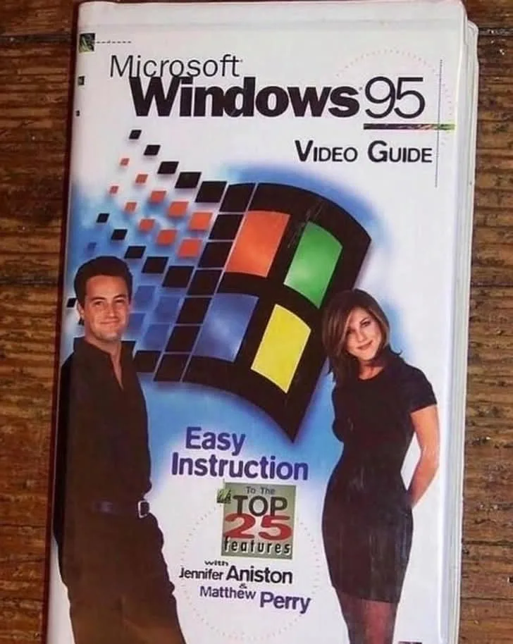 A VHS cover for a fictional 'Microsoft Windows 95 Video Guide' features actors Jennifer Aniston and Matthew Perry posing as…