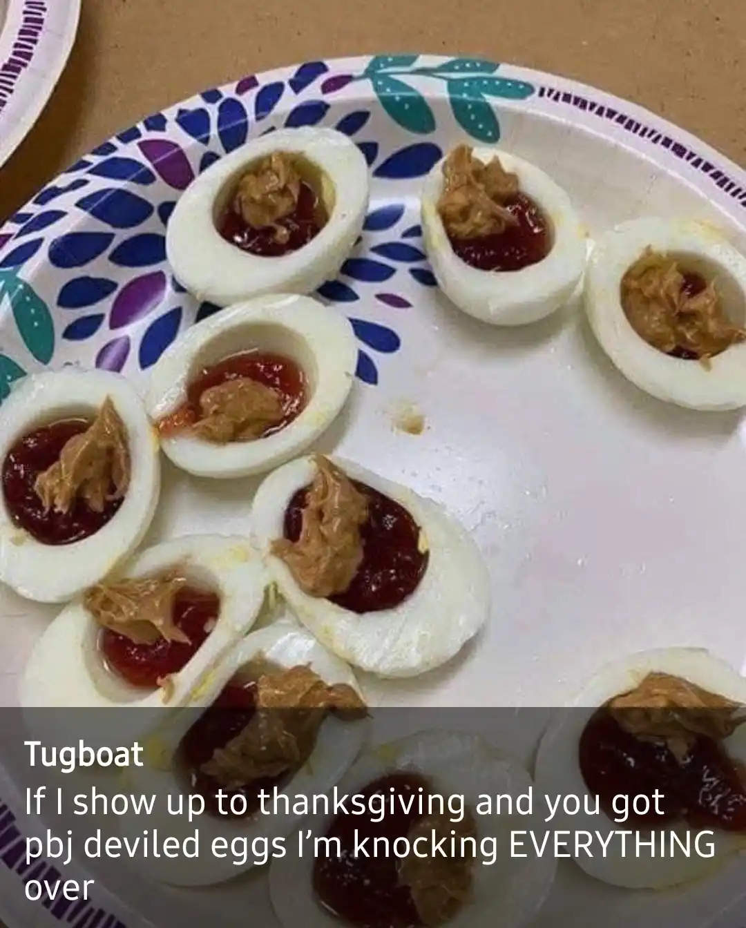 A plate of deviled eggs filled with peanut butter and jelly instead of traditional mayo and mustard, with overlaid text…