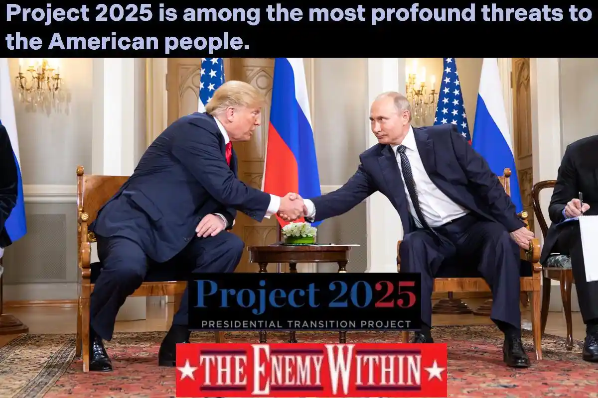 Two men in suits shake hands across a small table in a formal room with American and Russian flags behind them. Overlaid…