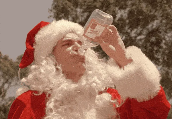 A composite image shows a man dressed as Santa Claus drinking directly from a clear bottle in three sequential panels, then…