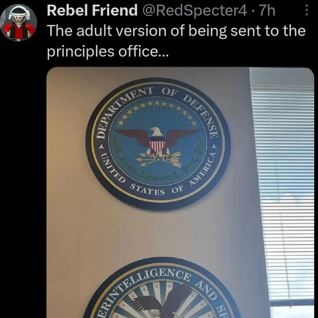 The image shows two official-looking circular seals mounted on a beige wall, one above the other. The top seal clearly reads…