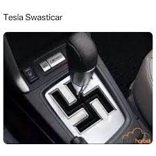 A close-up photo of a car's center console shows a gear shift lever positioned over a gear selector plate that has been…