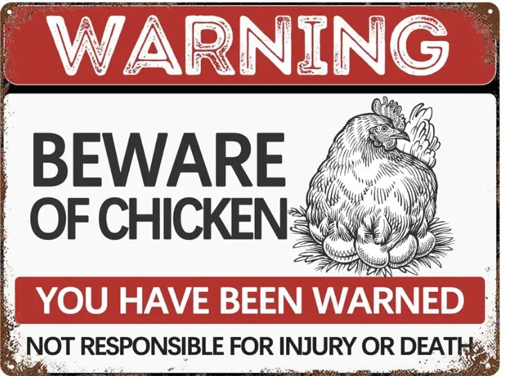 A weathered, rusty metal warning sign features bold red and white text. The top reads 'WARNING', the middle says 'BEWARE OF…