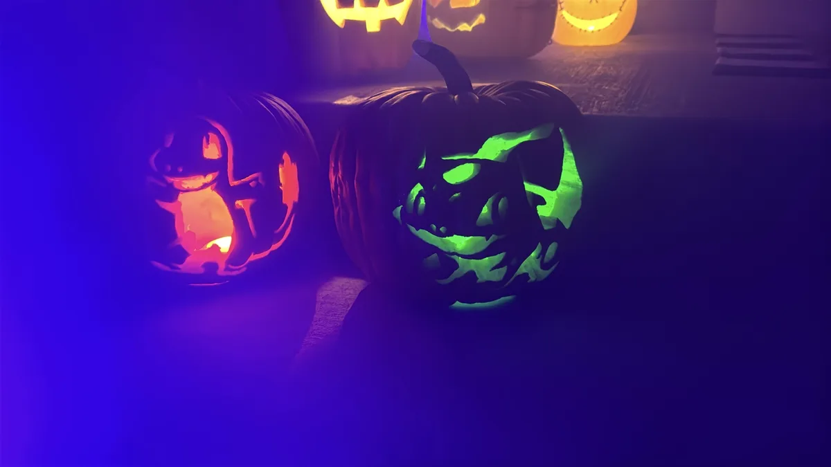 A dimly lit Halloween scene features several carved pumpkins, with two in the foreground glowing. The left pumpkin is carved…