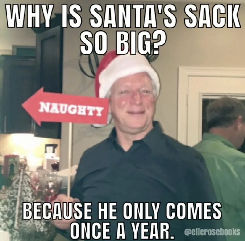 A man wearing a red and white Santa hat smiles while holding a red arrow sign that reads 'NAUGHTY'. The image has large…