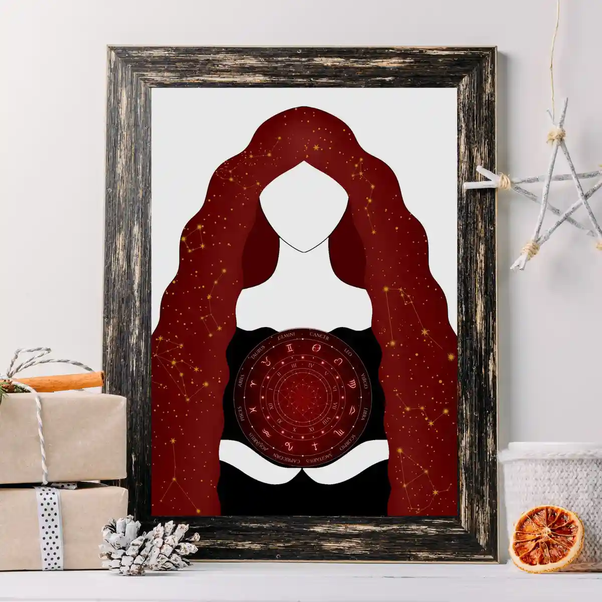 A framed art print depicts a stylized silhouette of a woman with long, flowing red hair decorated with golden stars and…
