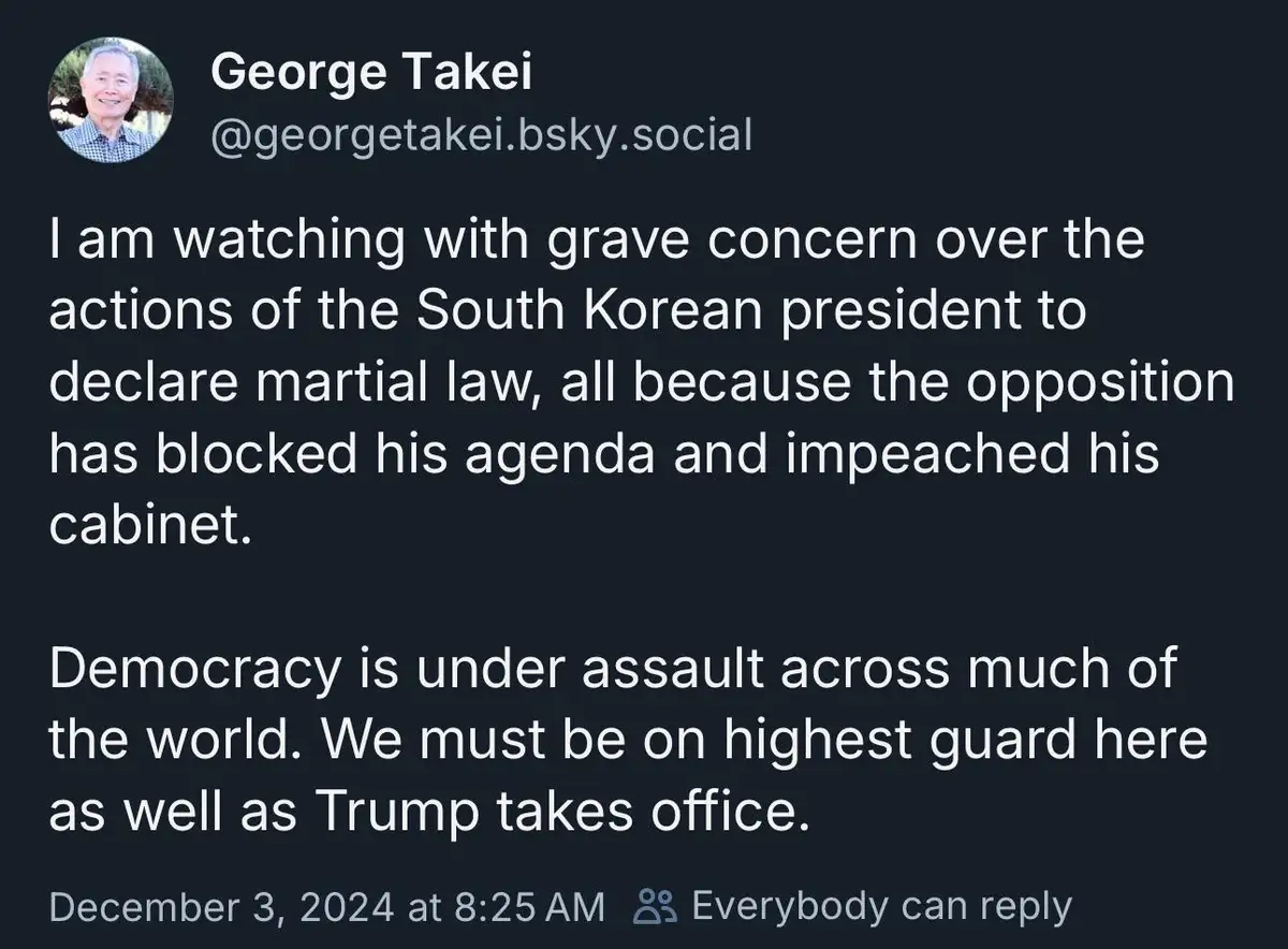 A screenshot of a social media post by George Takei, showing his profile picture and a dark-themed interface. The post text…