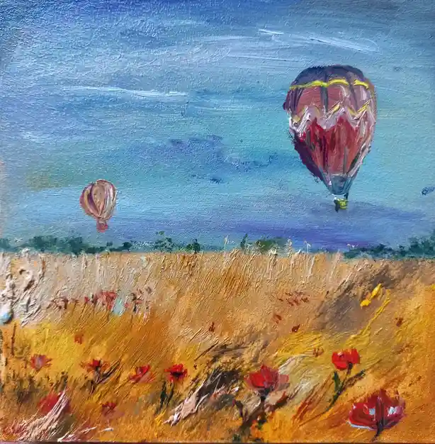 An oil painting depicts two hot air balloons floating over a golden field of tall grass and red poppies under a blue sky…
