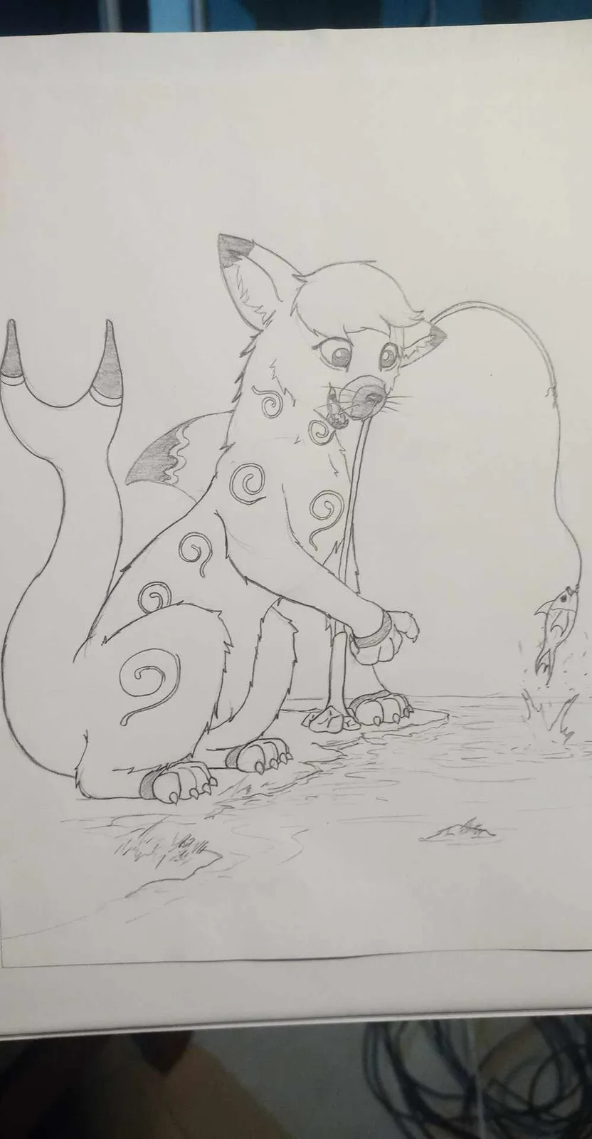 A pencil sketch shows a cartoonish, anthropomorphic fox-like creature with spiral markings and a long, curved tail sitting…