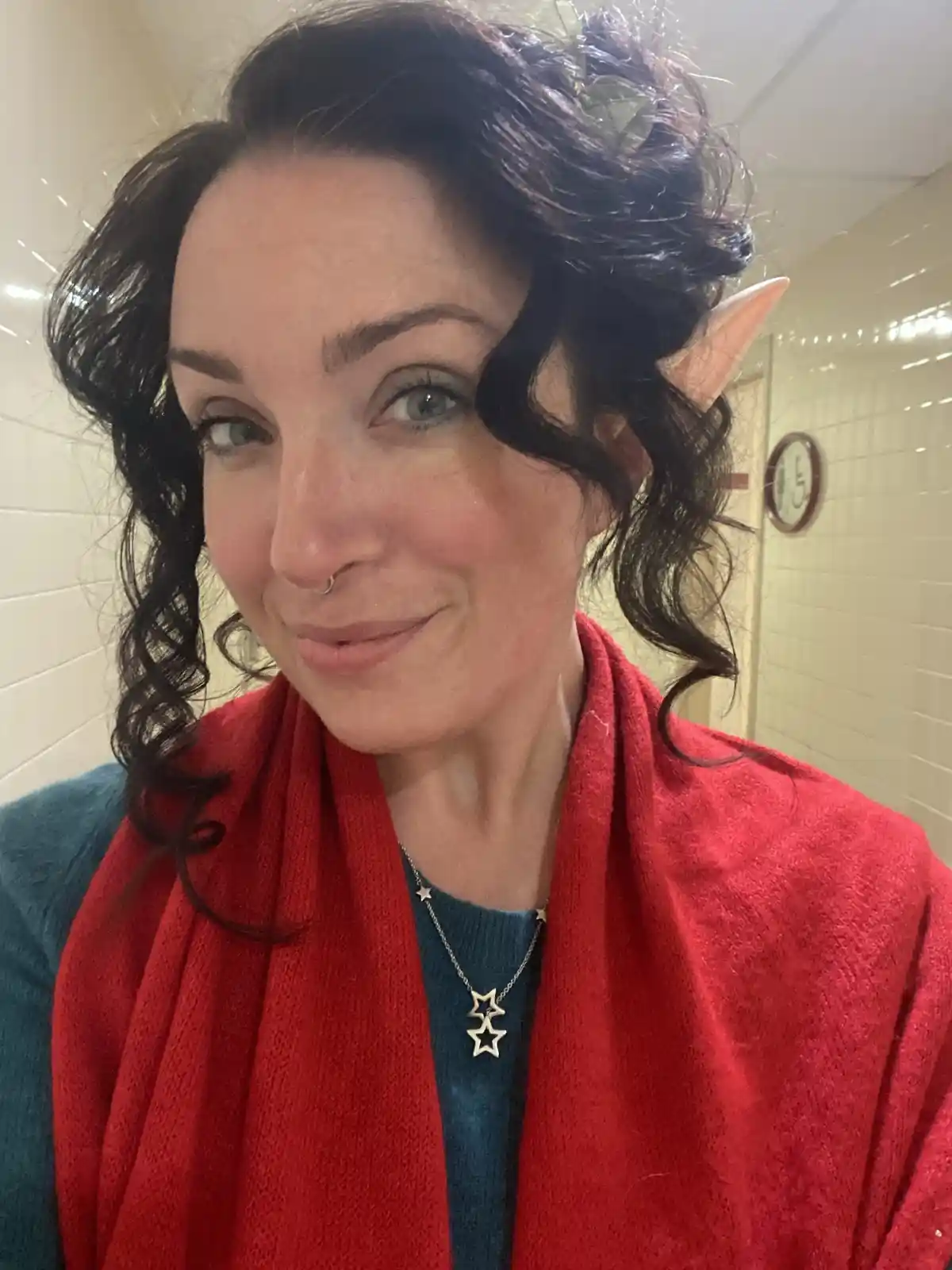 Sending cozy Christmas greetings from a cheerful Canadian elf!