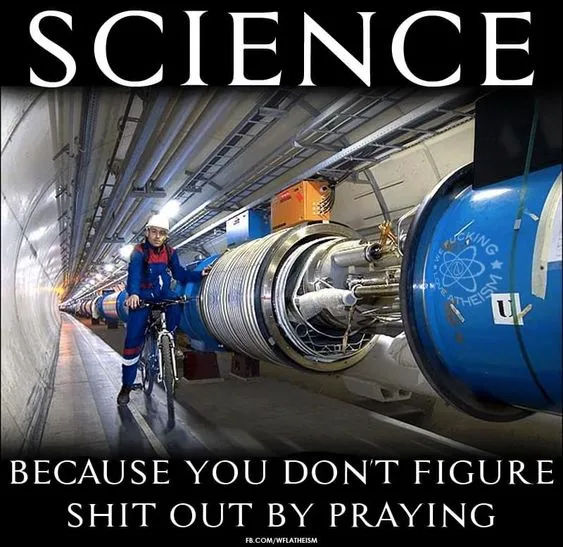 A person in a blue jumpsuit and hard hat rides a bicycle down a long, narrow tunnel next to a massive, complex scientific…