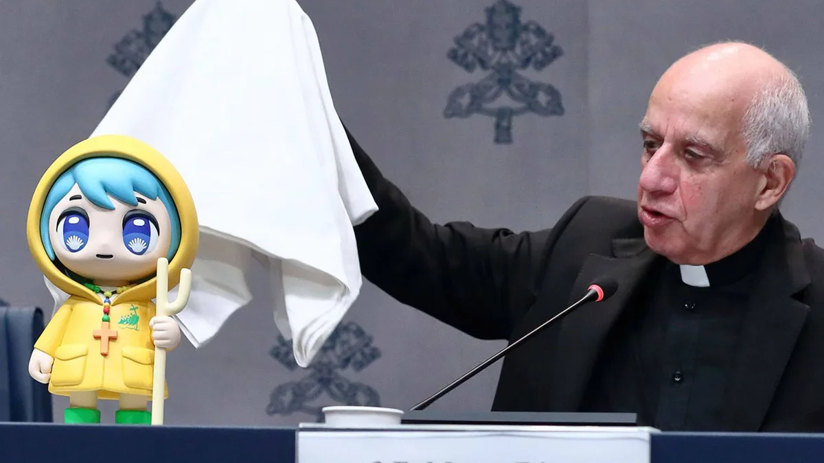 A man in a black clerical collar suit stands at a podium, raising a white cloth while speaking into a microphone. Beside him…