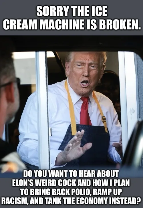 A man wearing a white shirt, red tie, and dark apron with yellow straps is seen through a car window, gesturing with both…