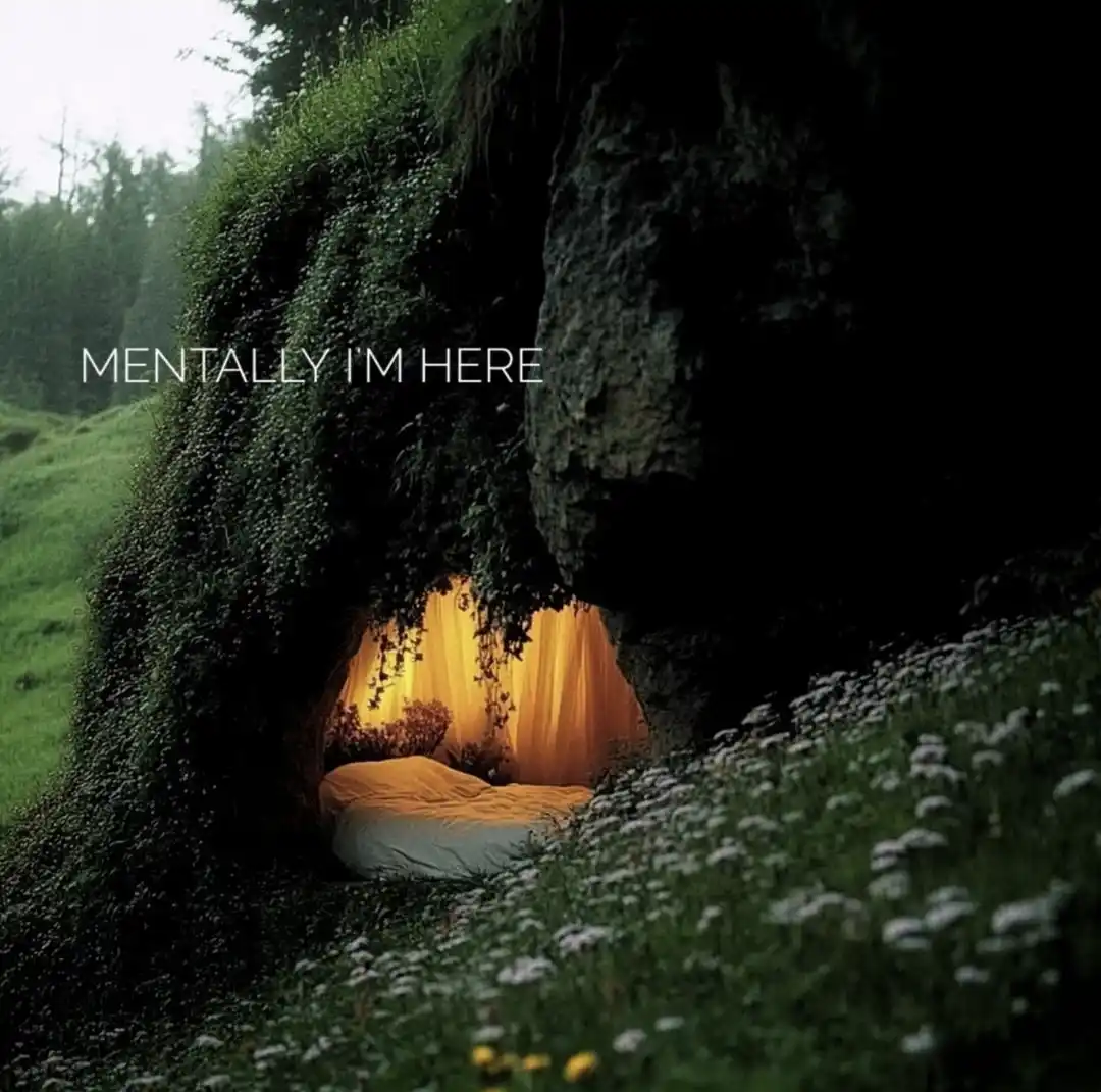 A serene, moss-covered cave nestled in a grassy field with wildflowers, revealing a cozy bed with warm yellow curtains…