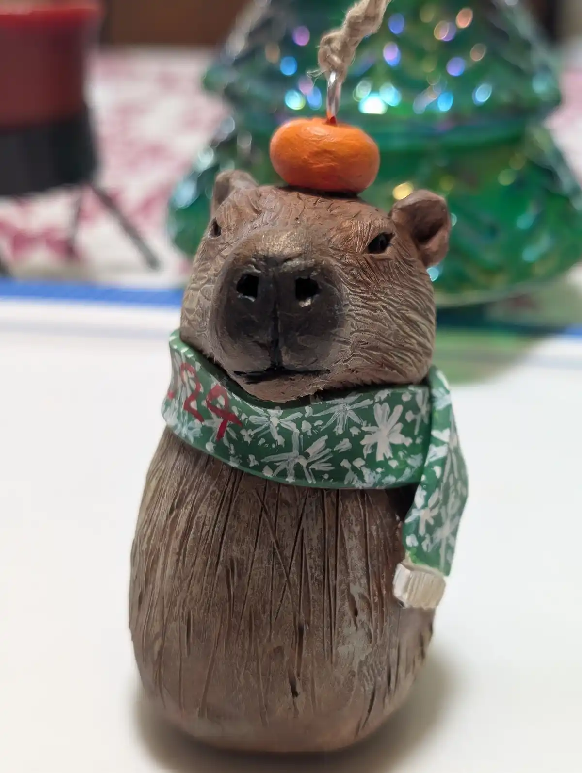 This Year's Holiday Ornament: A Capybara with an Orange Hat