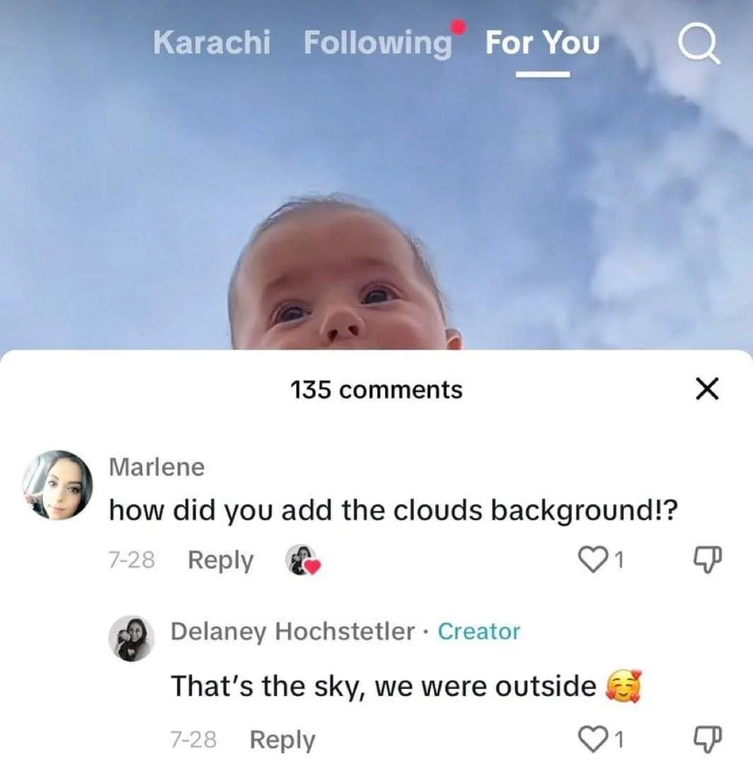 A screenshot of a social media post showing a baby looking up at the sky, with a comment asking how the clouds background…