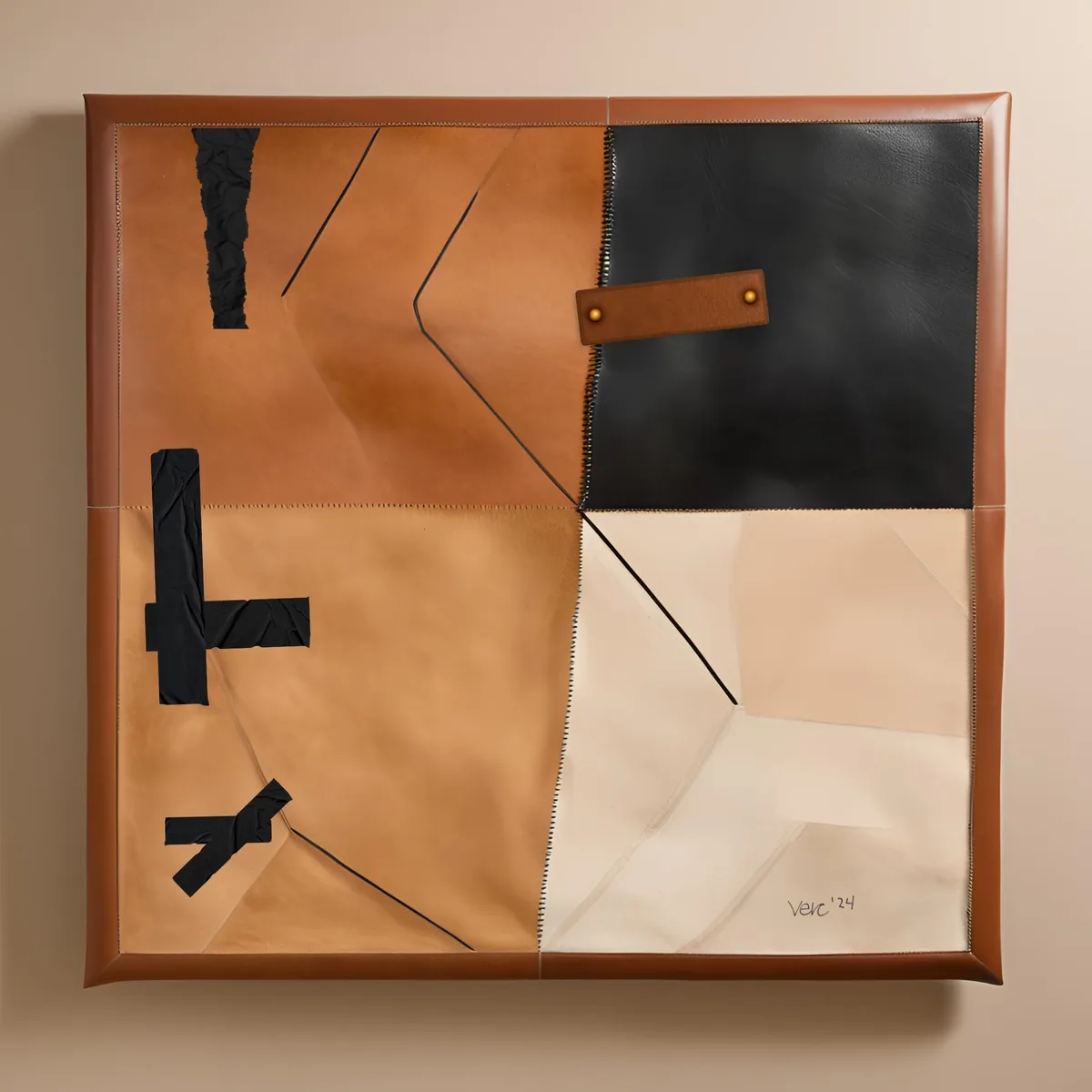 A square, framed abstract artwork made of stitched leather panels in tan, black, and cream, with black tape forming crude…