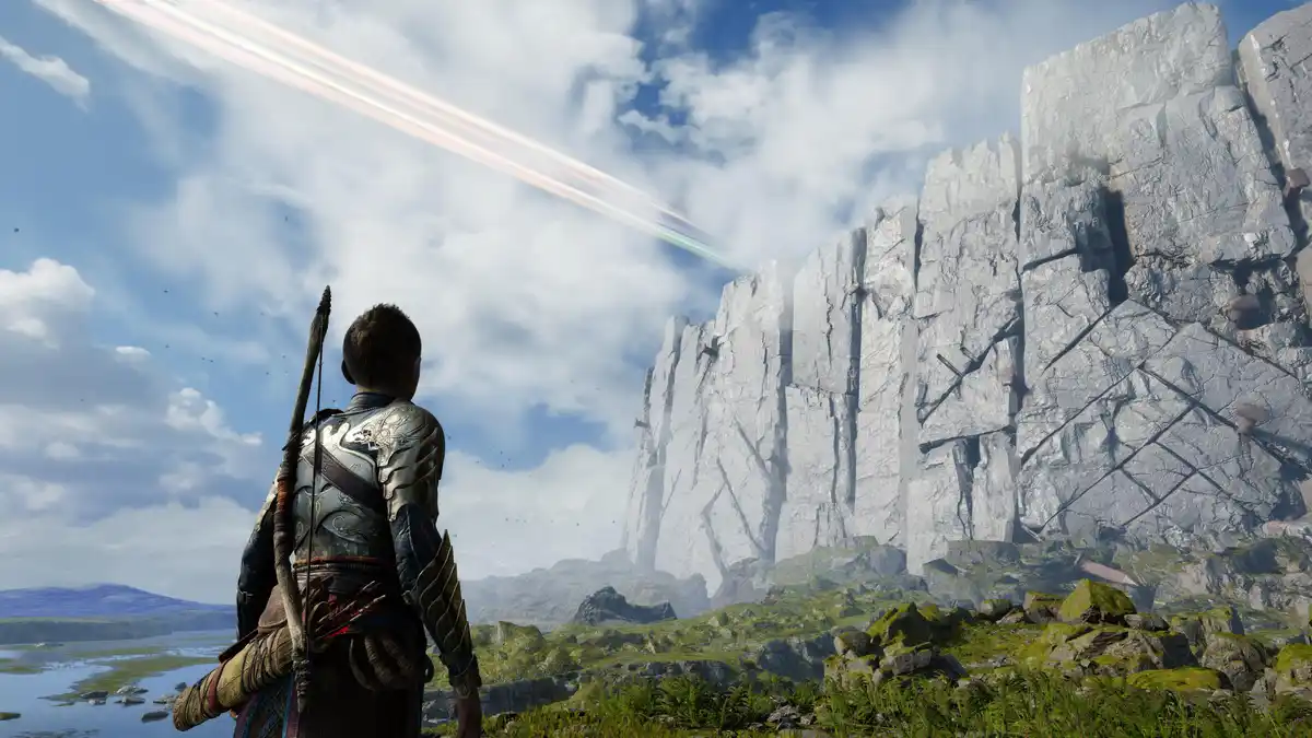A video game character in ornate armor stands with their back to the viewer, gazing at a towering, sheer cliff face under a…
