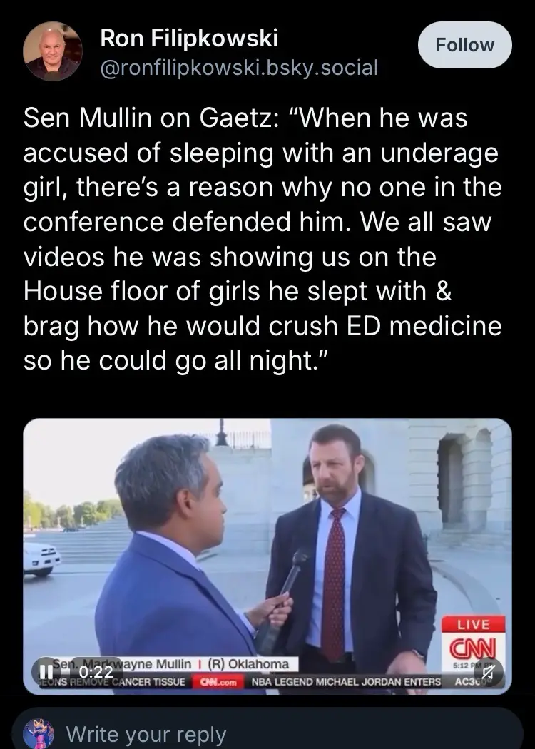 A screenshot of a CNN live interview shows Senator Markwayne Mullin in a suit being asked a question by a reporter. The…