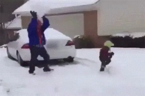 A composite image shows a person in a blue jacket throwing a snowball at a small child in a red jacket and yellow hat. The…