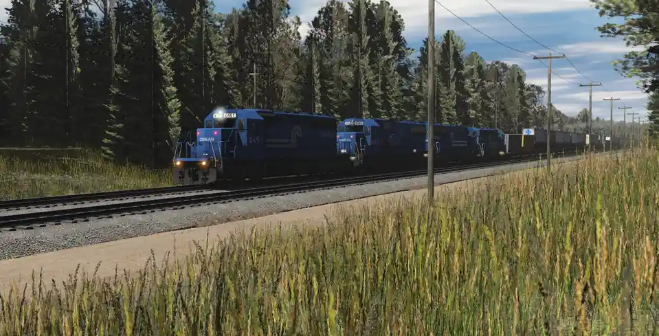 A digital rendering shows two blue Conrail locomotives, numbered 6491 and 6493, approaching each other head-on on a single…