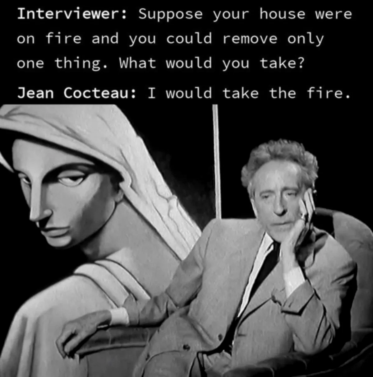 A black-and-white image shows French filmmaker Jean Cocteau seated, resting his chin on his hand, next to a large, stylized…