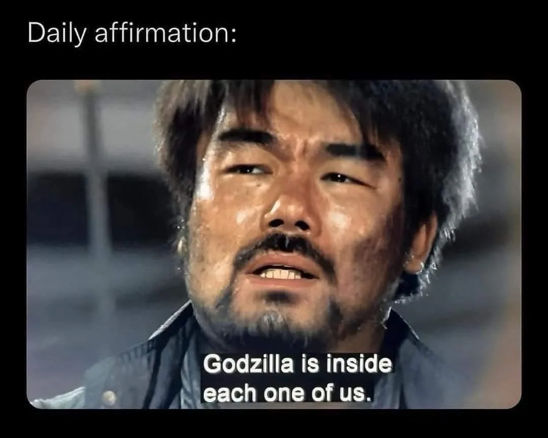 A close-up of a sweaty, determined man with a grim expression, overlaid with the text 'Daily affirmation: Godzilla is inside…
