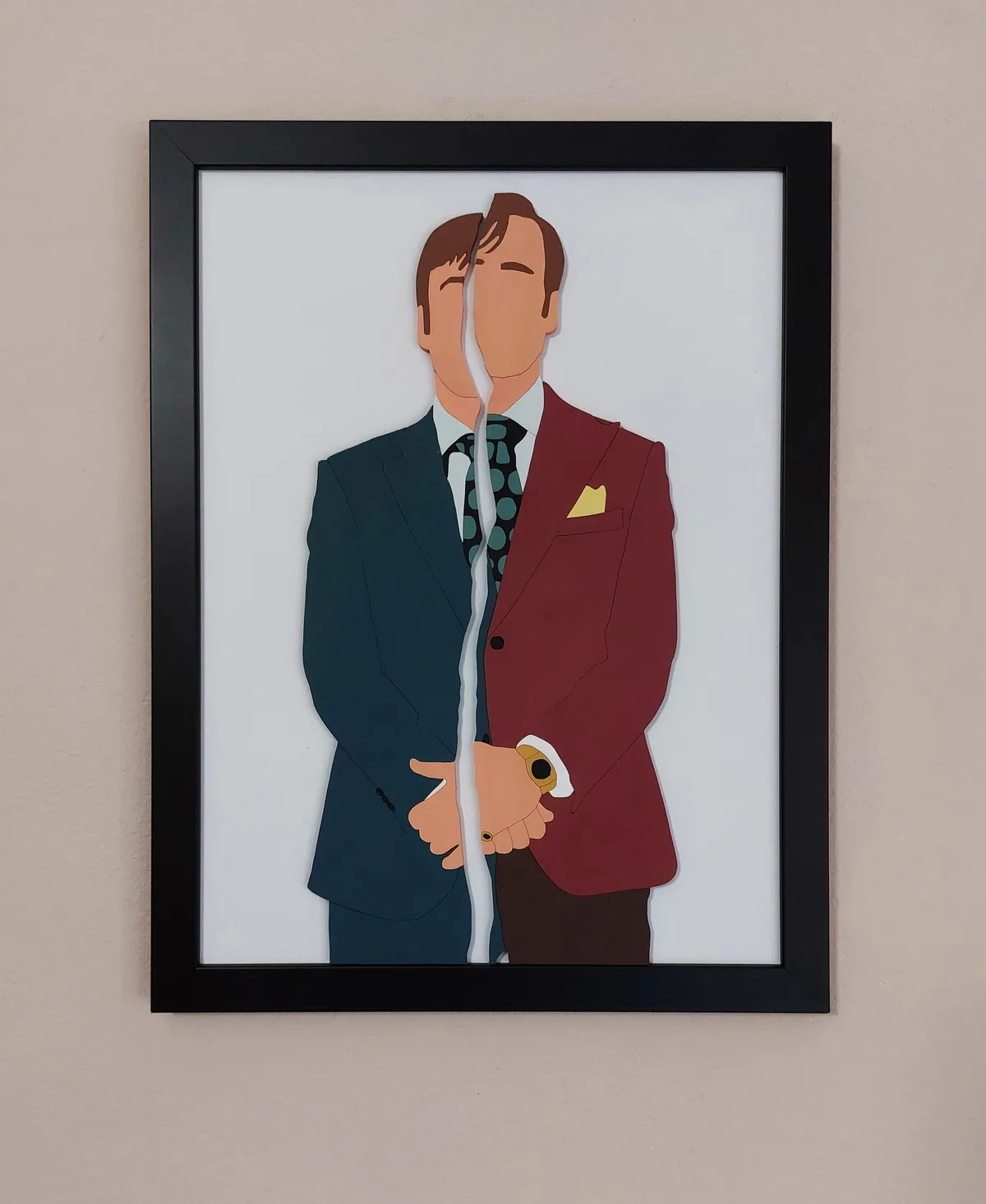 A framed artwork depicts a stylized man split vertically down the middle, with one half wearing a dark blue suit and the…