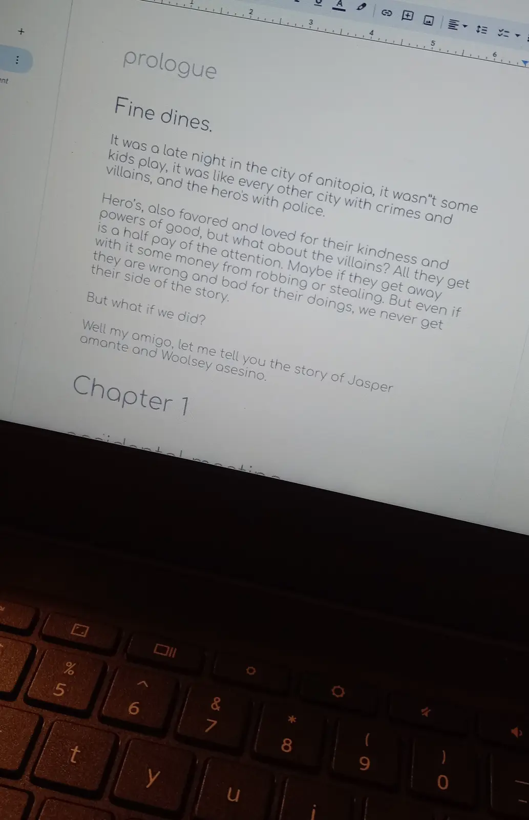 A laptop screen displays a document titled 'prologue' and 'Chapter 1', with text that begins with 'Fine dines.' and…