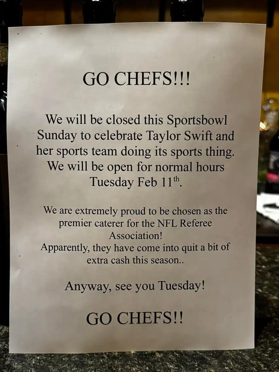 A printed sign on a countertop announces a restaurant's closure for 'Sportsbowl Sunday' to celebrate Taylor Swift, then…