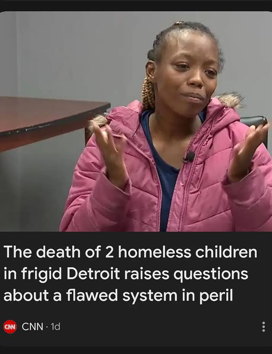 A woman in a pink puffer jacket sits in what appears to be an interview setting, gesturing with both hands open as if…