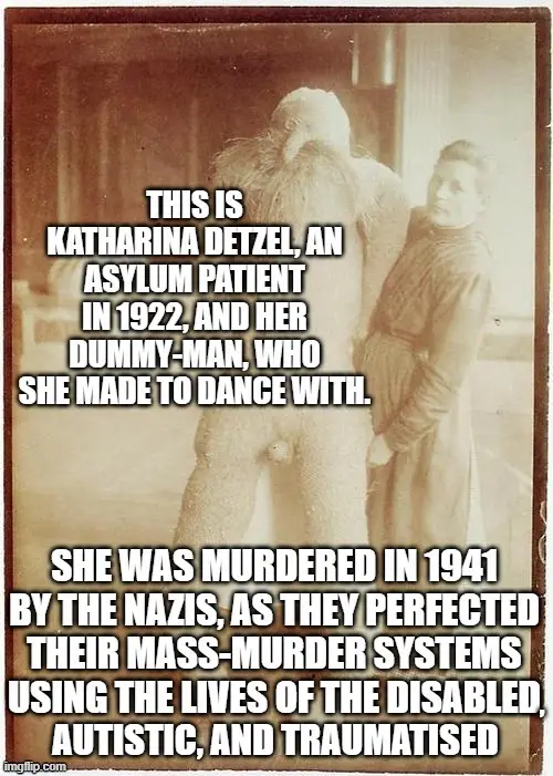 A sepia-toned historical photograph shows a woman standing beside a large, life-sized dummy. White text overlaid on the…