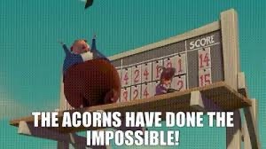A cartoon squirrel wearing a blue shirt and red pants is shown celebrating atop a wooden scoreboard. The scoreboard displays…