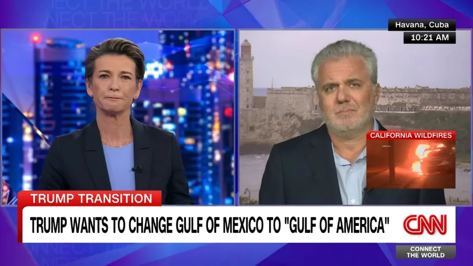 A split-screen CNN news broadcast shows a female anchor in a studio with a cityscape background and a male correspondent in…