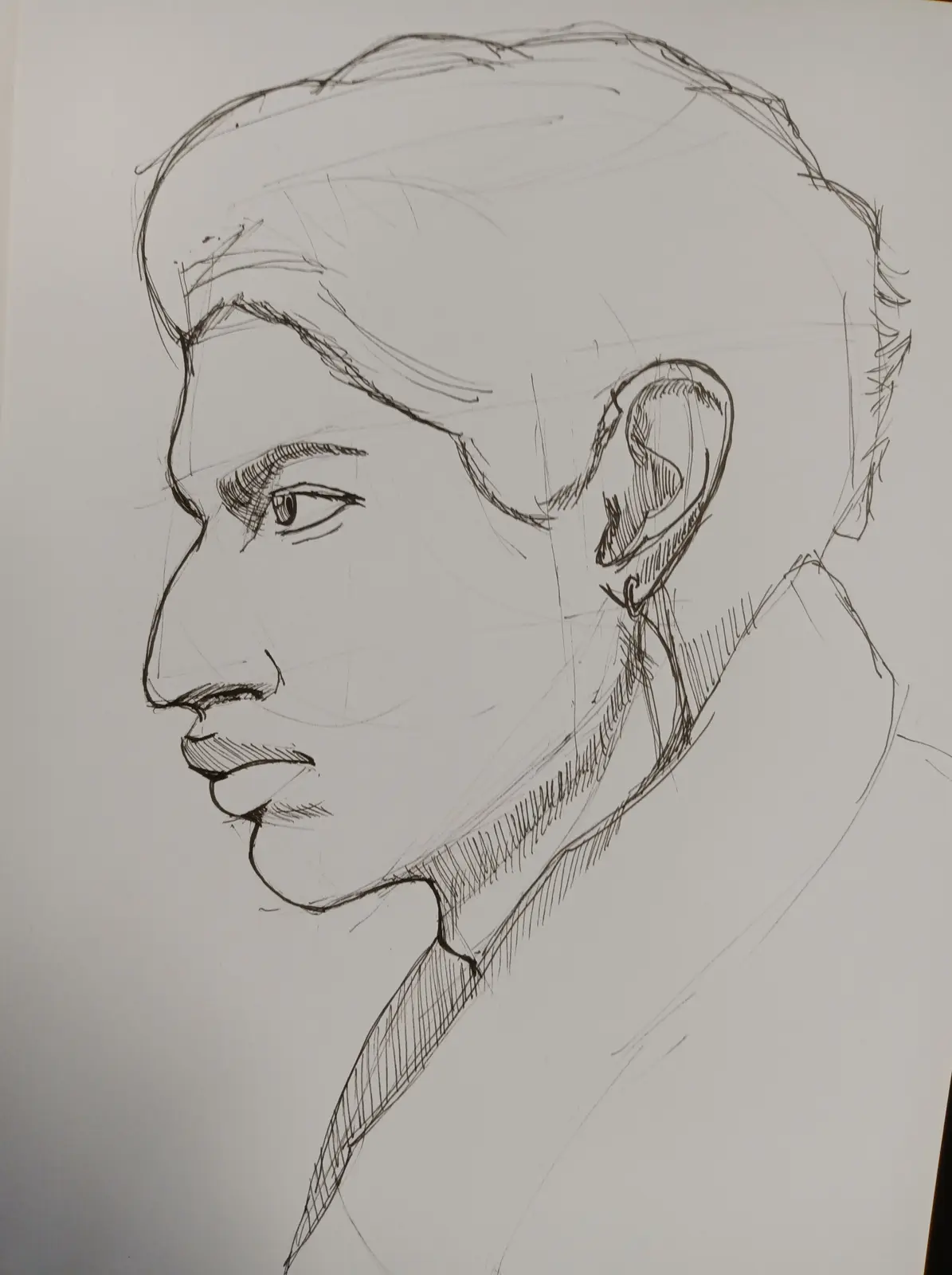 A black-and-white pencil sketch shows a person's head and shoulders in profile, with visible sketch lines and shading. The…