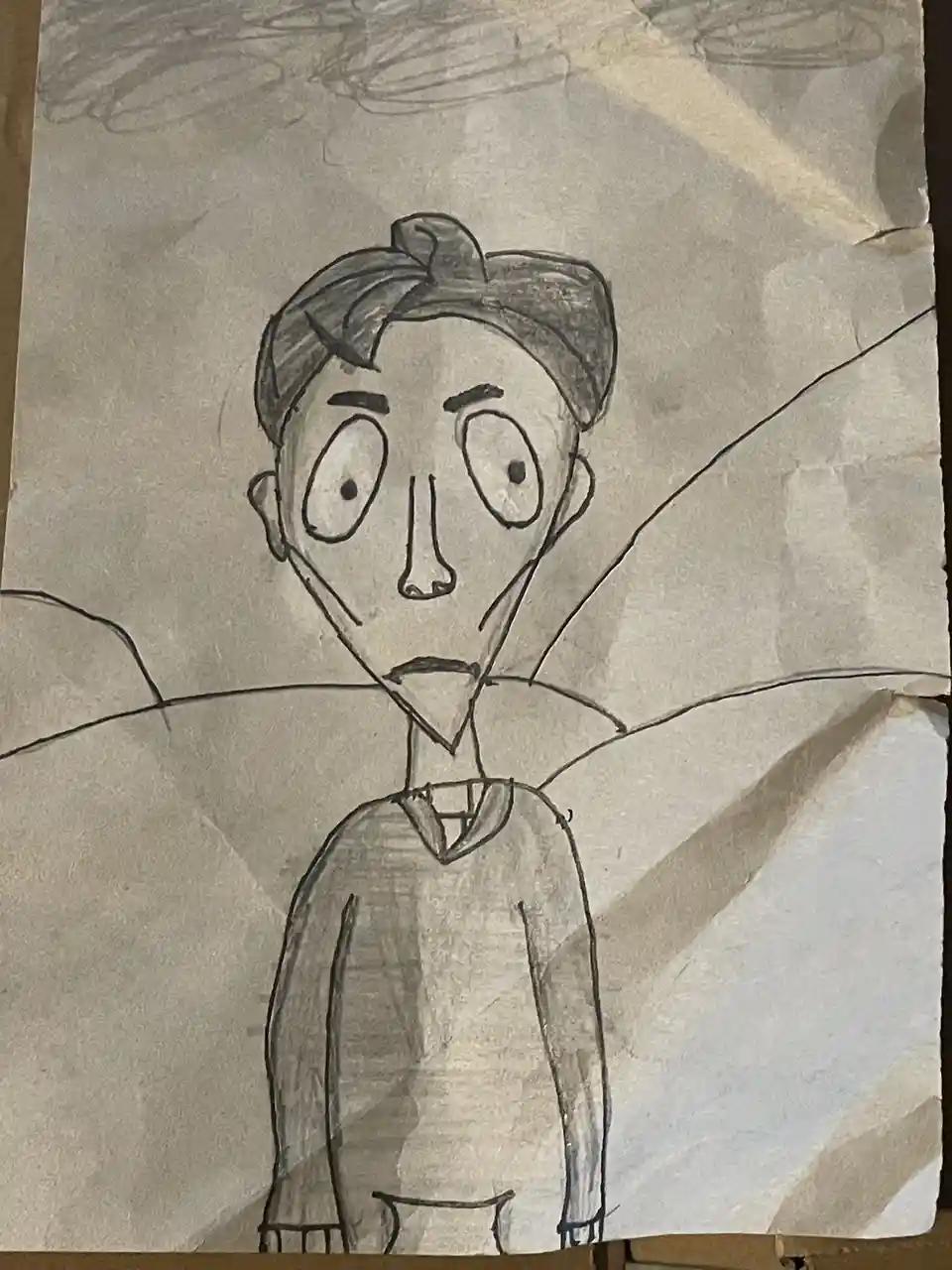 A hand-drawn cartoon sketch on textured paper depicts a person with large, wide eyes, a triangular chin, and a surprised…