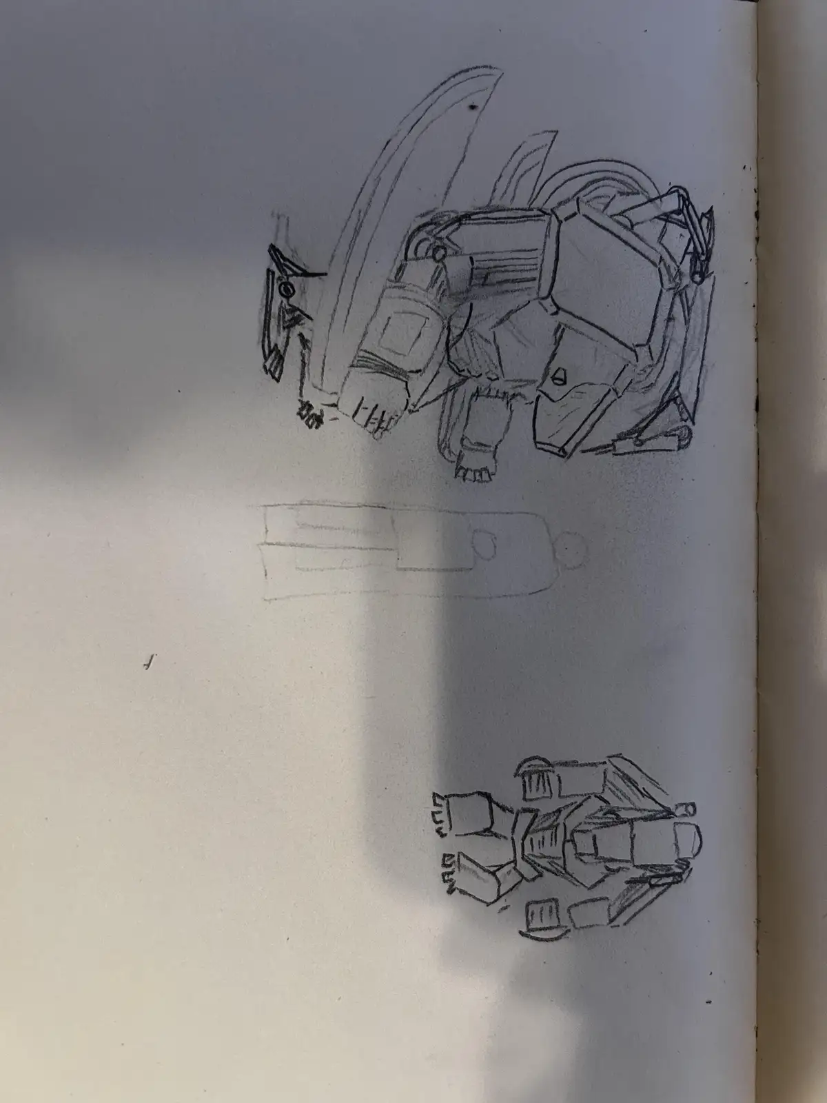 A hand-drawn pencil sketch on paper shows three separate robot designs. The top robot is detailed with wings and a…