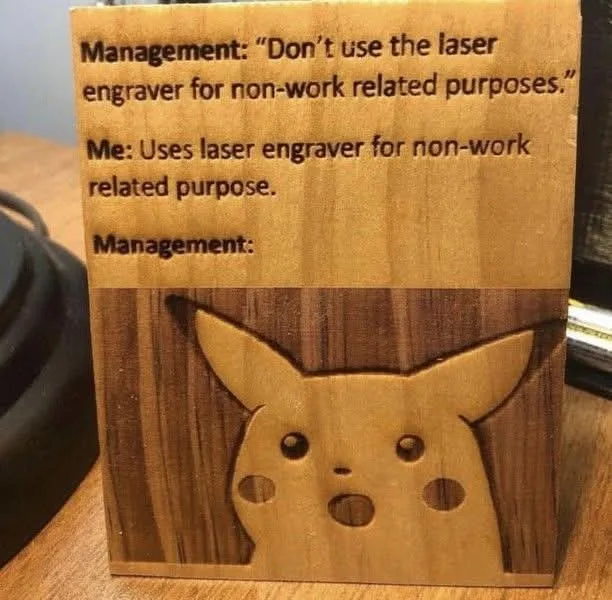 A wooden block with laser-etched text and a cutout of Pikachu's surprised face. The text shows a humorous exchange…