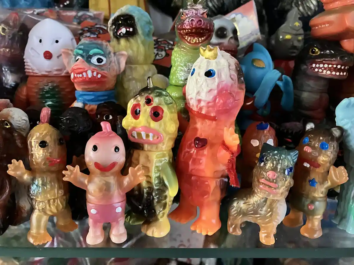A dense collection of vintage, colorful plastic monster toys, many with exaggerated features like big eyes, sharp teeth, and…