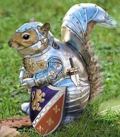 A squirrel wearing full silver knight armor, including a helmet, breastplate, gauntlets, and a shield with a lion and…