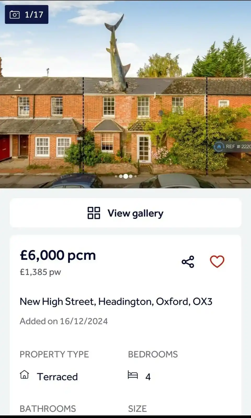 A real estate listing screenshot shows a typical brick terraced house in Oxford with a giant shark sculpture embedded in its…