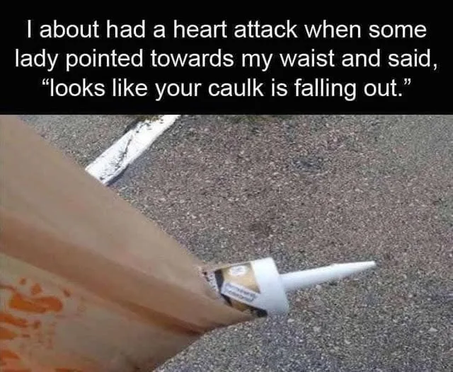 A close-up photo shows a tube of white caulk protruding from the bottom of a brown paper bag, placed on a gravel or asphalt…