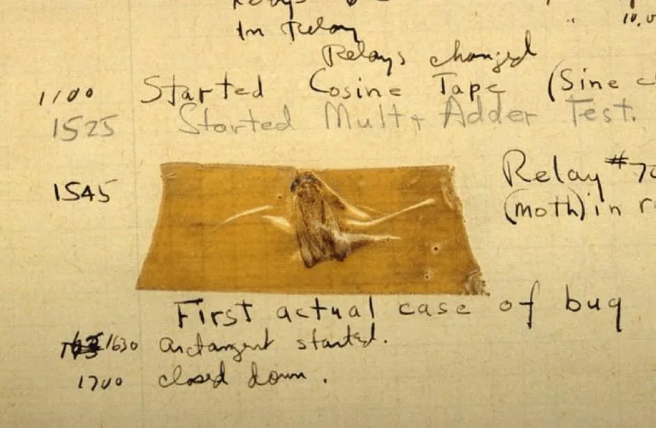 A historical document with handwritten notes and timestamps shows a dead moth taped onto a page, labeled as the 'First…