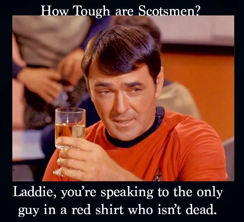 A man in a red Star Trek uniform holds a glass of liquid while looking intently at the viewer. The image has white text…