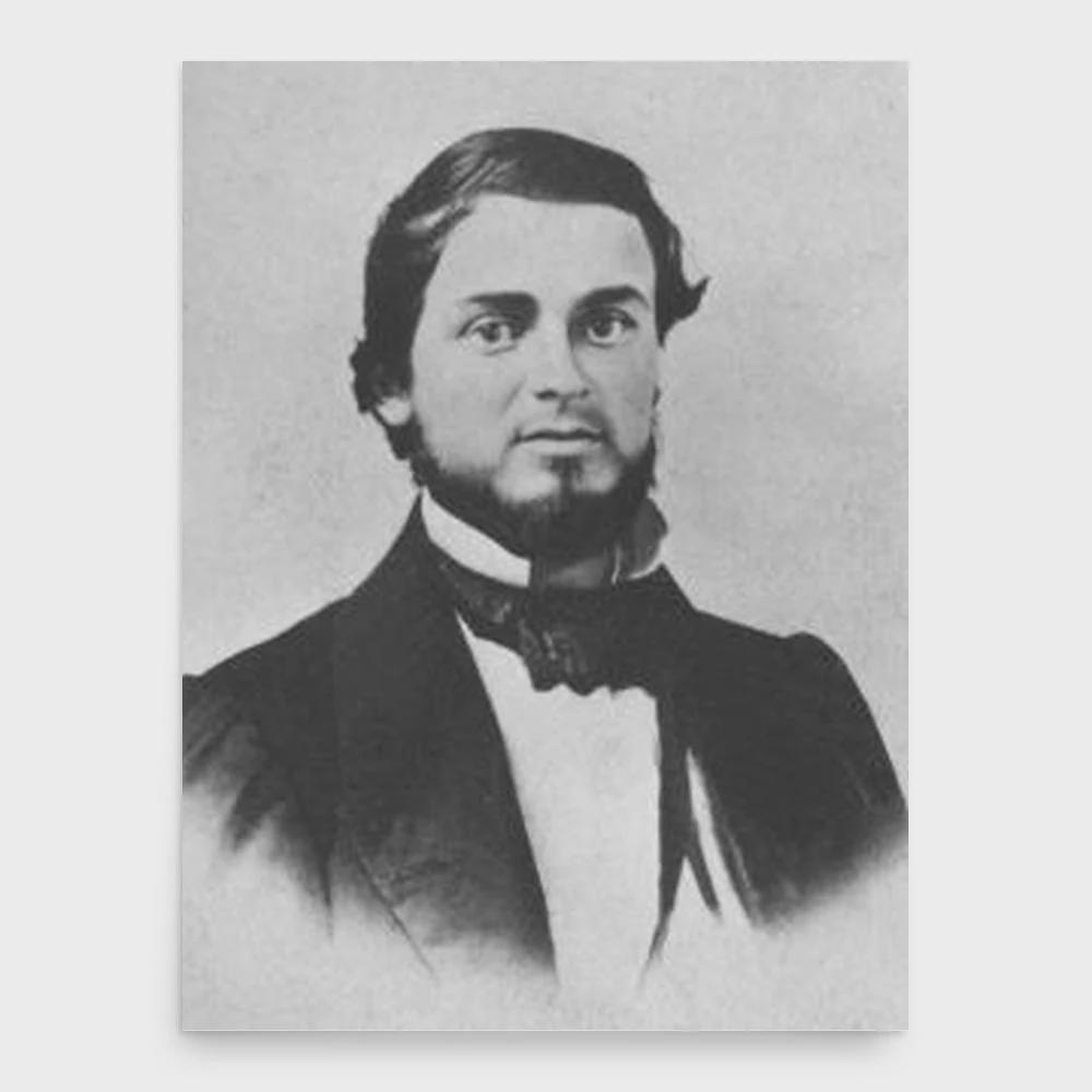A black-and-white portrait of a 19th-century man with a beard and bow tie, looking directly at the viewer. The overlaid text…